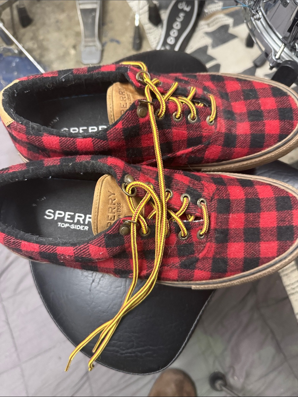 Sperry Red and Black Plaid Boat Shoes with Yellow Laces.
